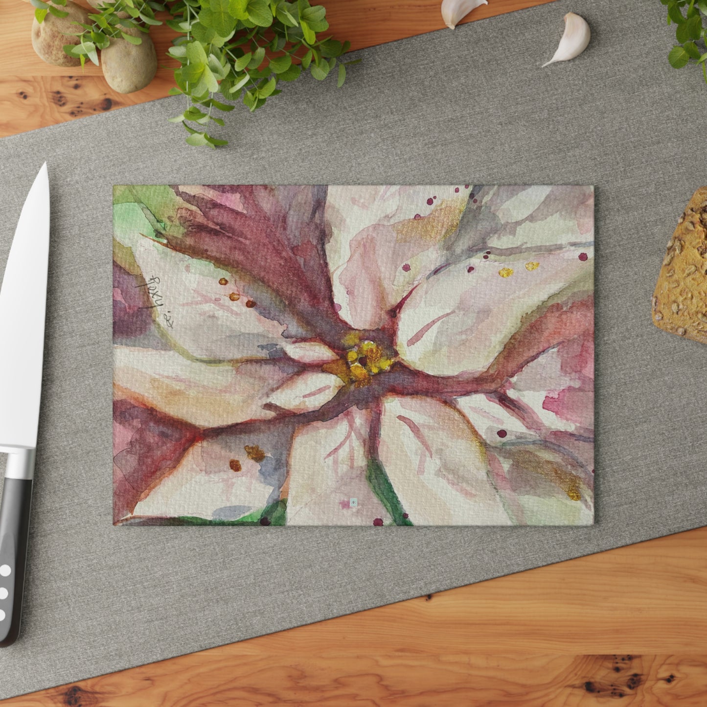 Tabla de cortar de vidrio con flor de Pascua blanca