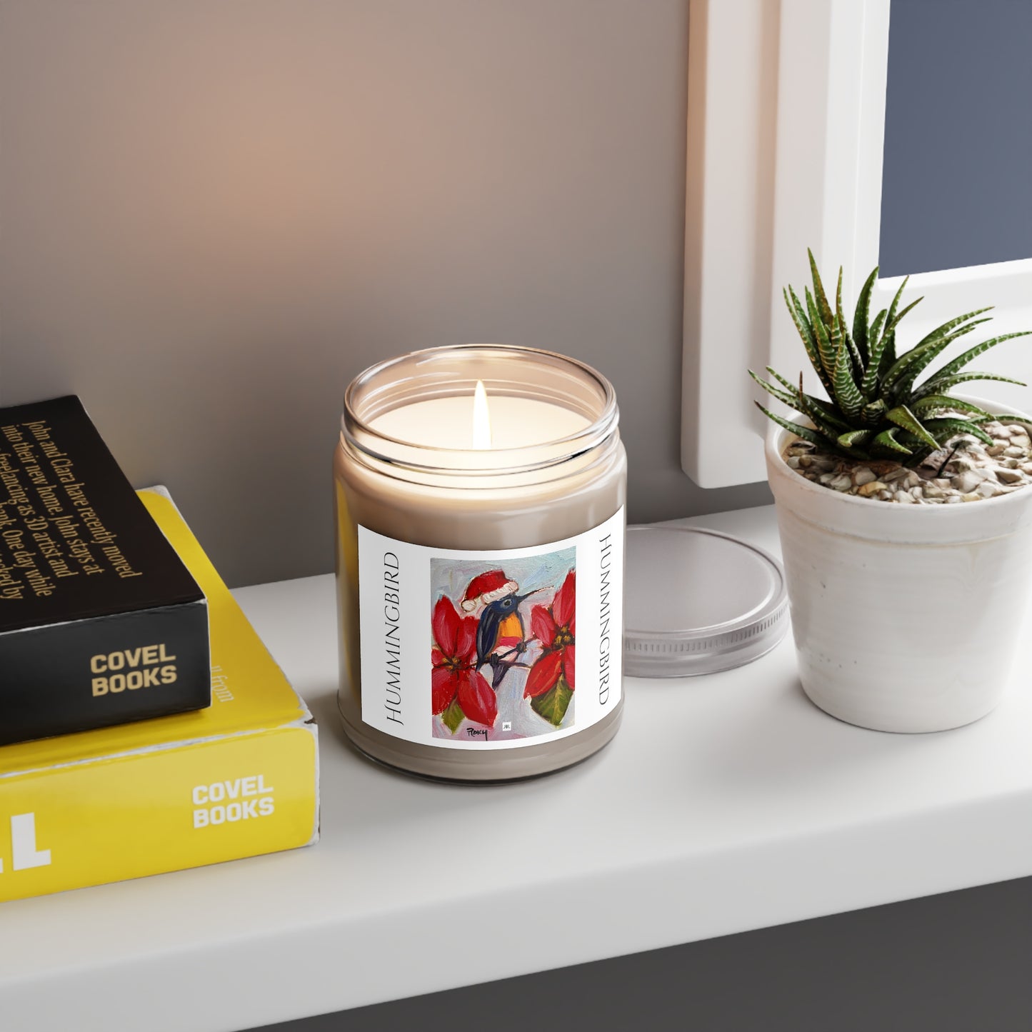 Bougie parfumée Colibri des Fêtes dans un chapeau de Père Noël 9oz