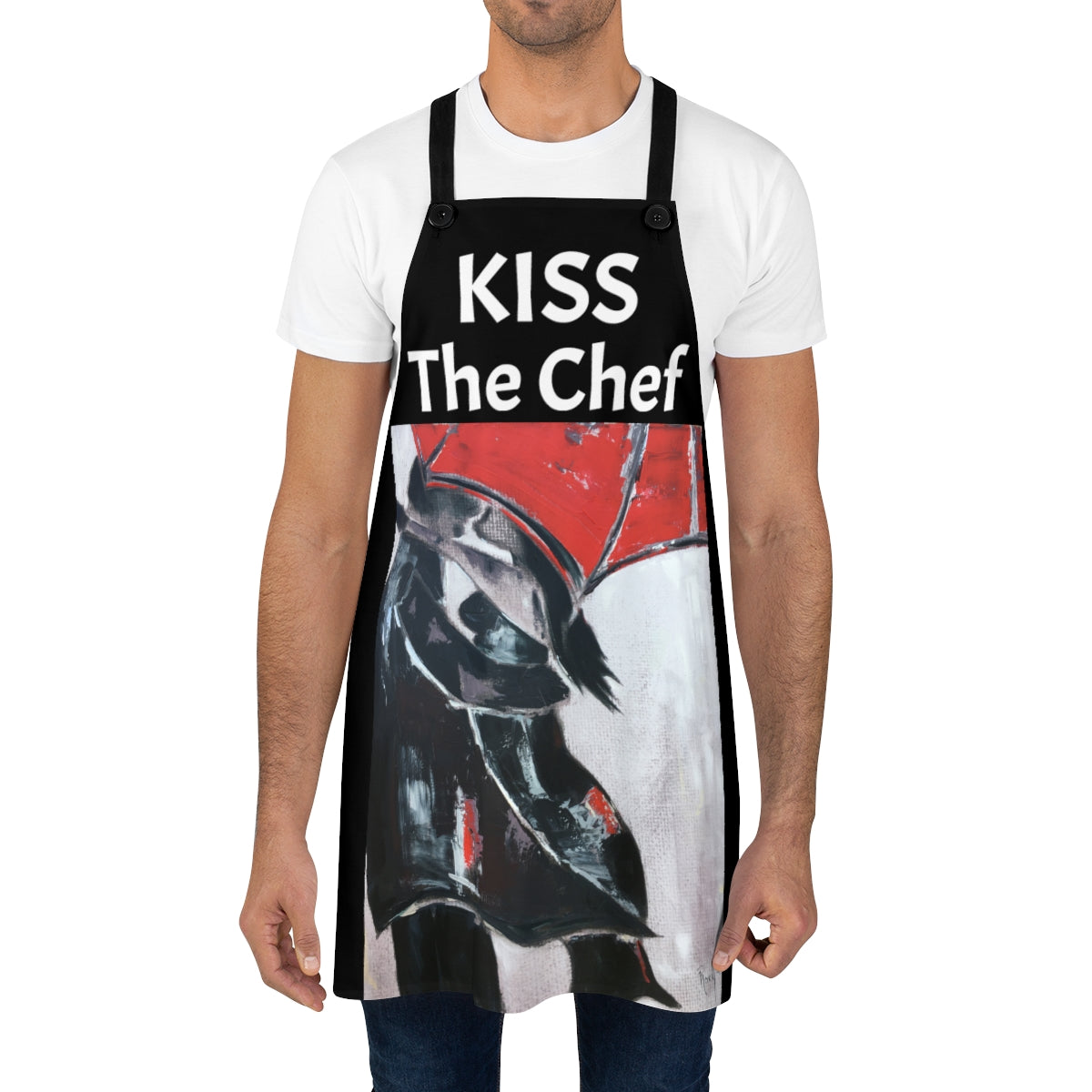 Besa al chef con un delantal de cocina negro con amantes originales bajo un paraguas rojo